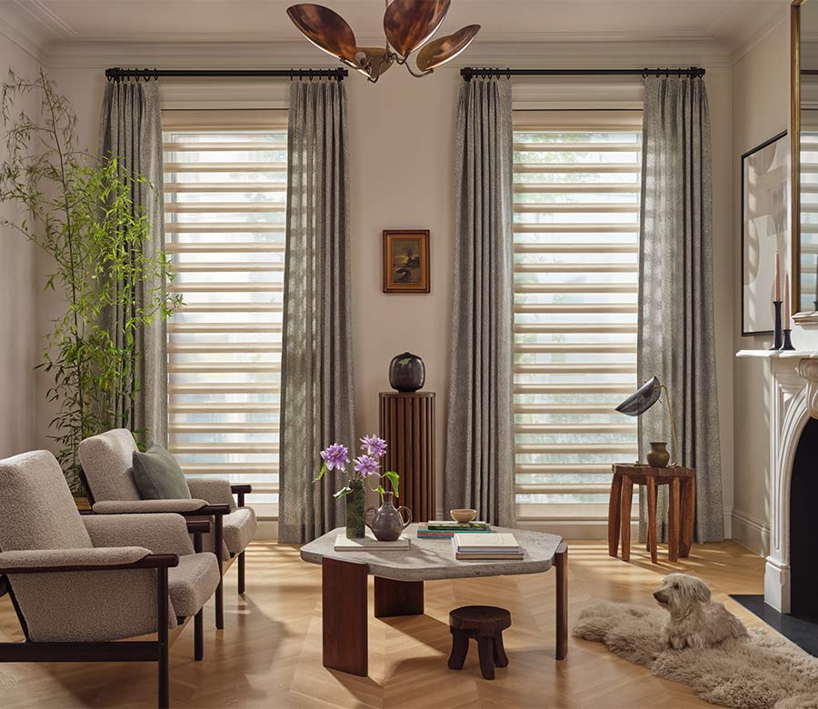pirouette-window-treatments-sheer-curtains-layered-look-living-room-hunter-douglas-creative-blinds Pirouette window shades with curtains in living room during daylight