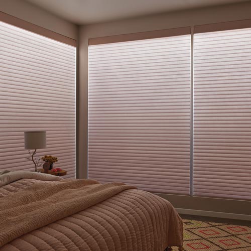 Aura® Illuminated Shades with integrated lighting and Sonnette® Cellular Roller Shades
