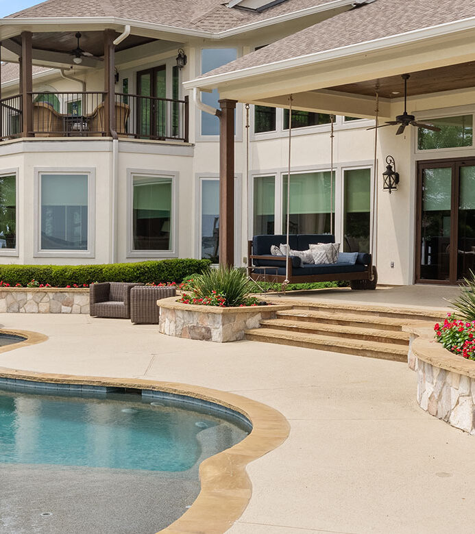 Exterior view of Lake Conroe home with Hunter Douglas Designer Roller Shades