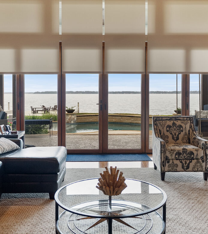 Light-filtering Designer Roller Shades framing Lake Conroe views