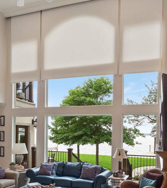 Light-filtering Designer Roller Shades framing Lake Conroe views