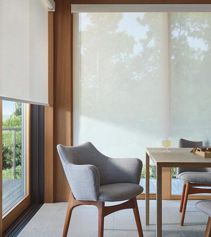 large window in dining room with white shades